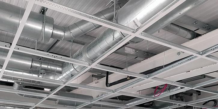 Suspended ceiling installers working in London office